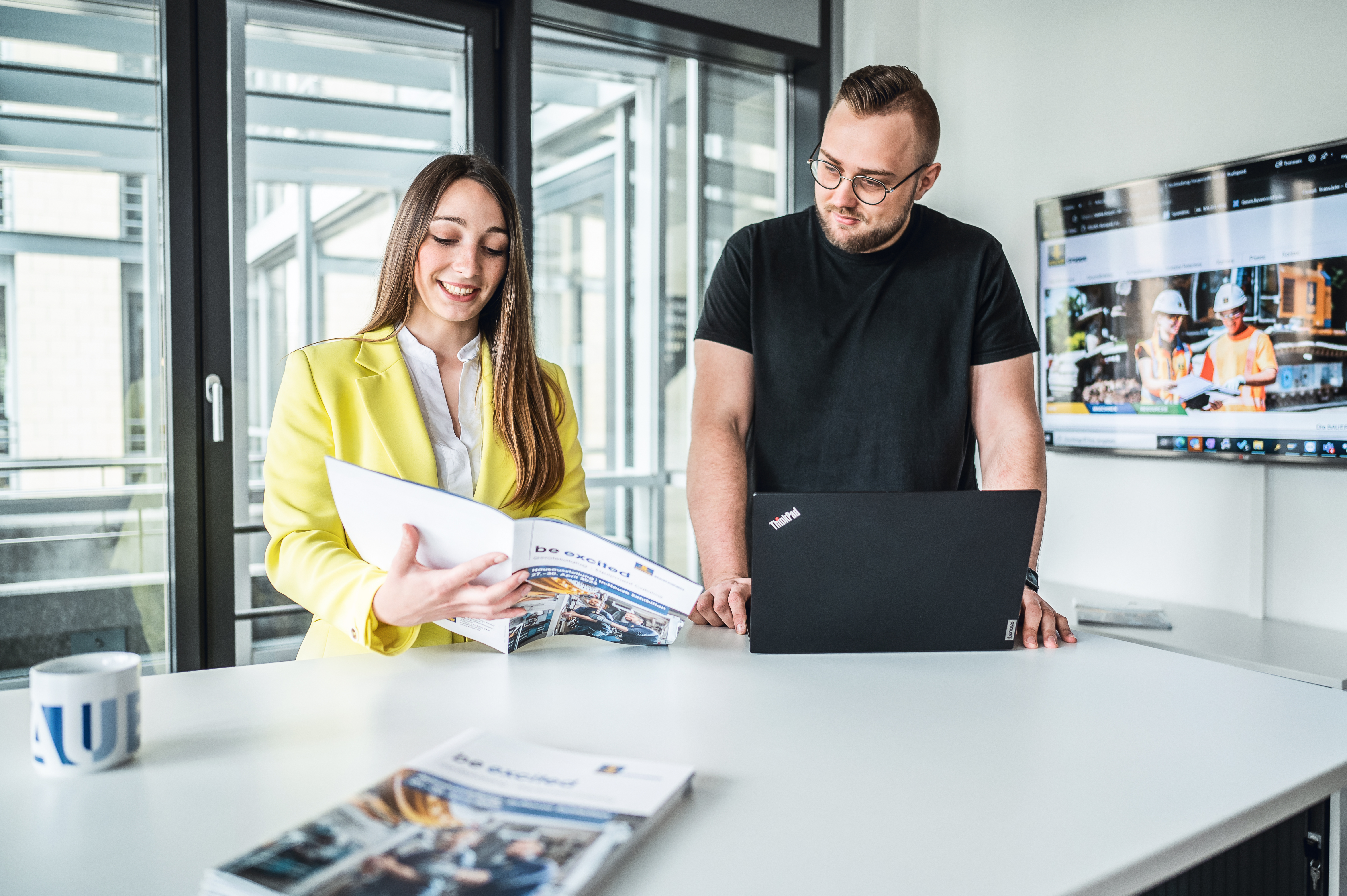 two young employees work together