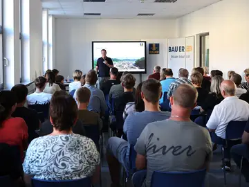 Training Manager Gerhard Piske answered questions and provided information about the new apprenticeship program in surveying technology.